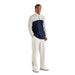 Off-Angle view of a model wearing the Malbon Aurora Midlayer, a Men's Quarter Zip in Navy White
