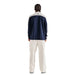 view from the back of a model wearing the Malbon Aurora Midlayer, a Men's Quarter Zip in Navy White