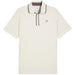 A white golf polo shirt from Puma and arnold palmer in warm white viewed from the front