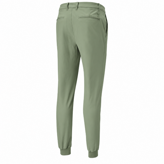 A rear view of the Puma Dealer golfer's Jogging bottoms in a dark sage colour