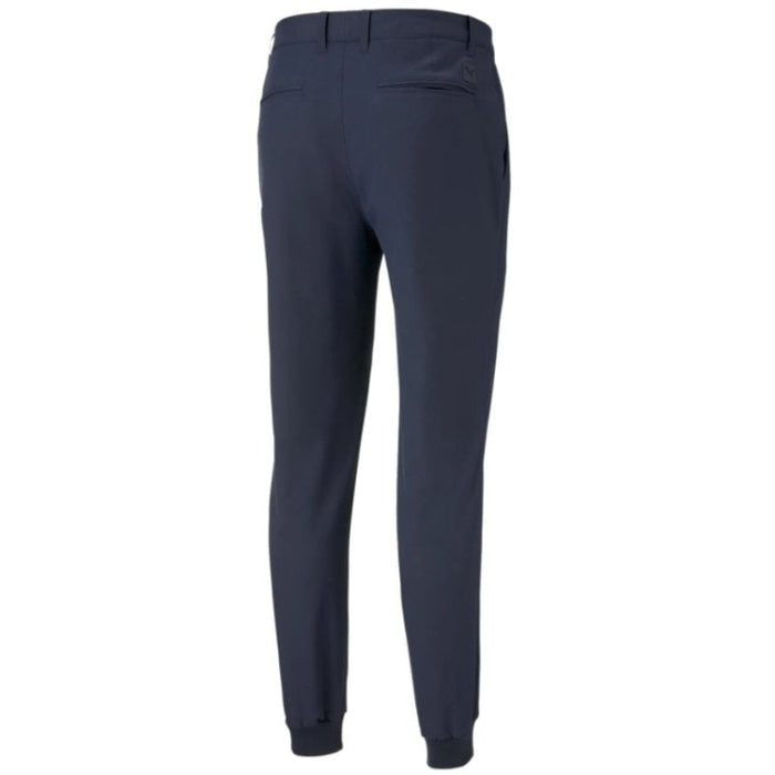 A rear view of the Puma Dealer golfer's Jogging bottoms in a deep navy colour
