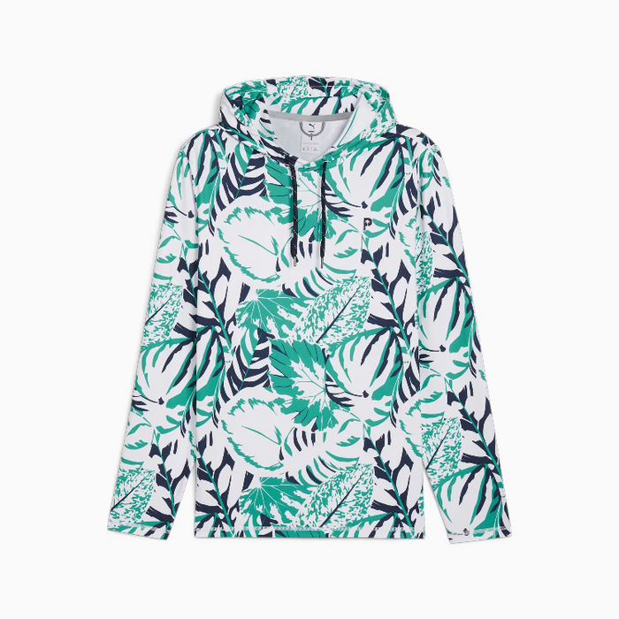 A puma x palm tree crew long-sleeve hooded golf sweatshirt with an all-over tropical leaf print in green, teal, navy, and white, shown flat against a light gray background.