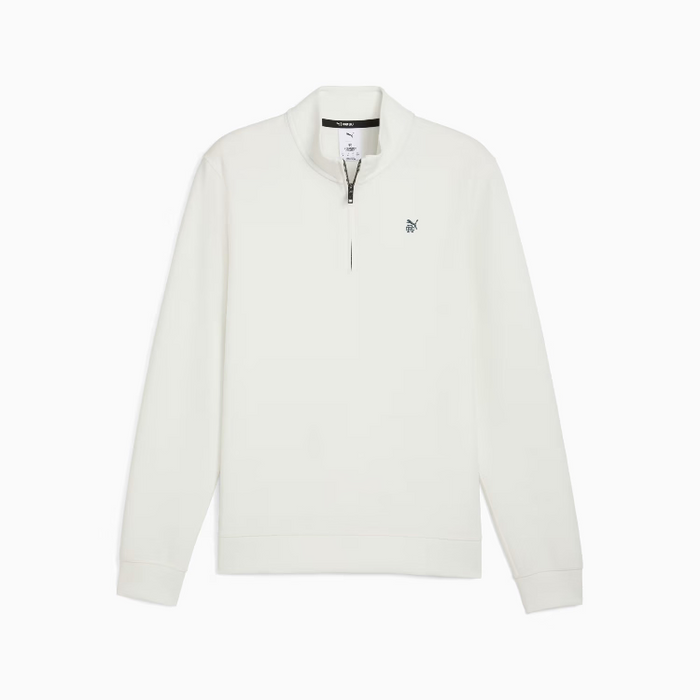 A warm white long-sleeve puma golf quarter-zip sweatshirt with a small embroidered logo on the left chest, displayed on a clean white background.