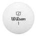 A white dimpled golf ball with the Wilson brand name and shield logo printed in black, and the number 1 in red, centered on a plain white background.