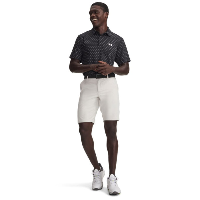 zoomed out View of the Under armour tapered drive shorts being worn by a model as seen from the front